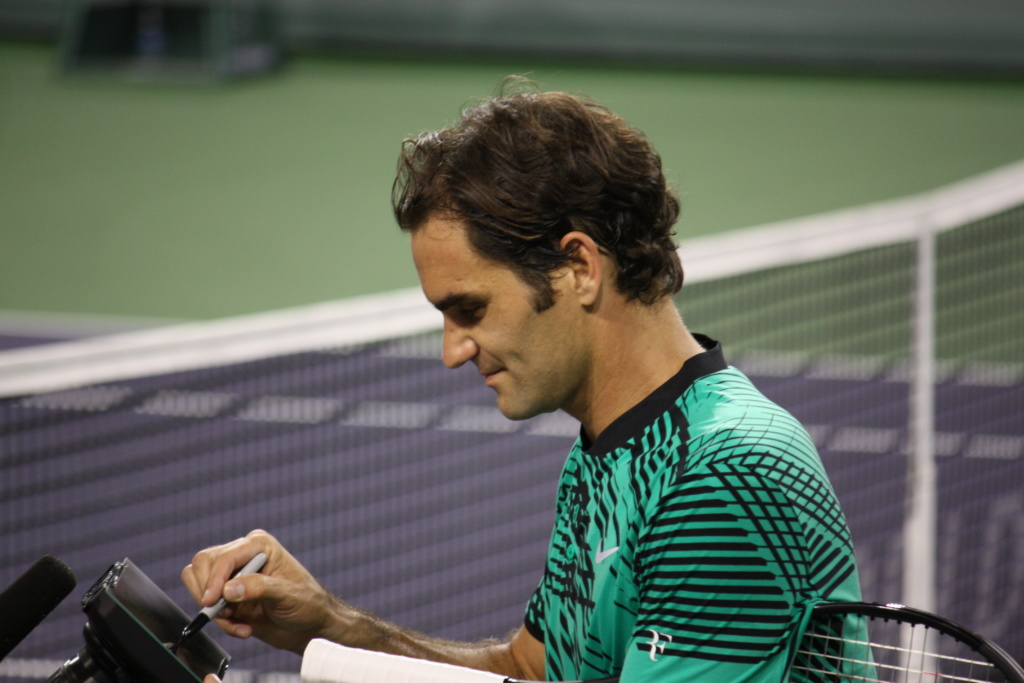 Roger Federer signs an autograph at the BNP Paribas Open in Indian Wells, California